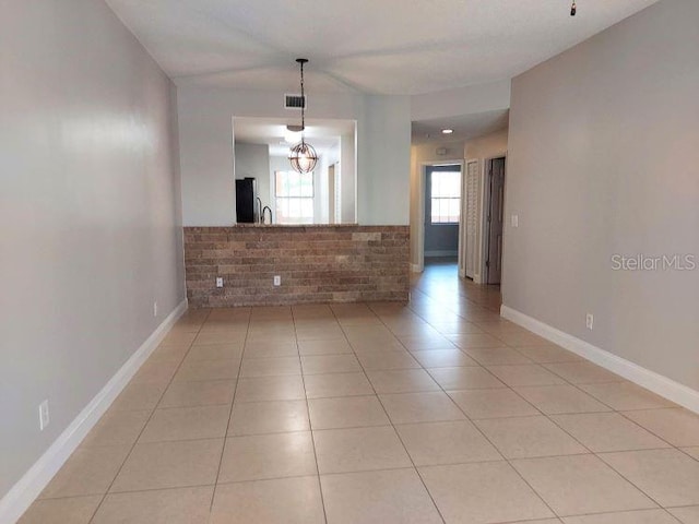 95 Rivers Edge Ln Unit 95, Palm Coast, FL 32137 - unfurnished room featuring light tile patterned flooring, a sink, and baseboards