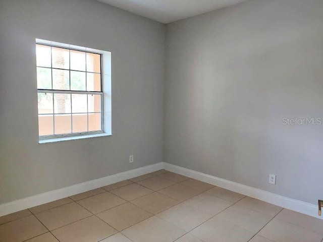 95 Rivers Edge Ln Unit 95, Palm Coast, FL 32137 - unfurnished room with baseboards and light tile patterned floors