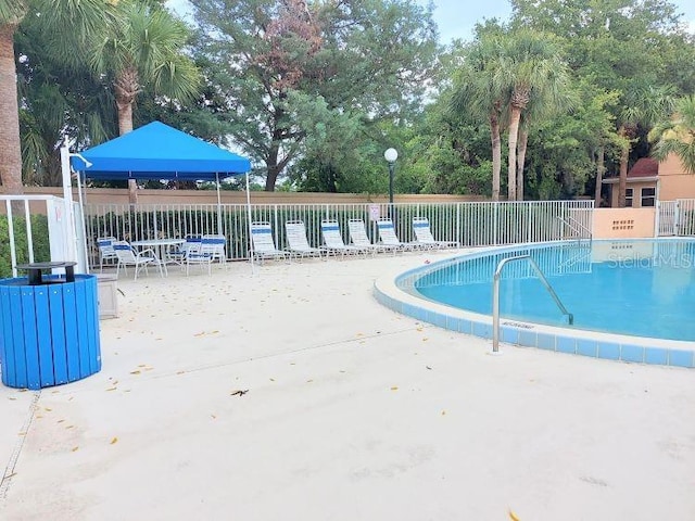 95 Rivers Edge Ln Unit 95, Palm Coast, FL 32137 - community pool with a patio area