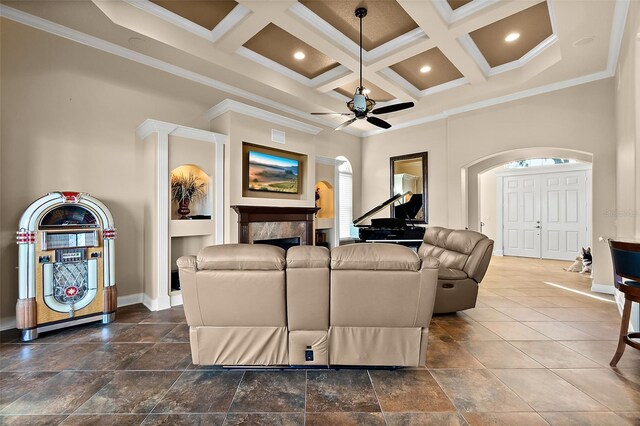 207 S Riverwalk Dr, Palm Coast, FL 32137 - living area with arched walkways, crown molding, coffered ceiling, ceiling fan, and beam ceiling