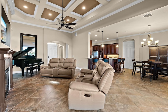207 S Riverwalk Dr, Palm Coast, FL 32137 - living area with arched walkways, crown molding, ceiling fan, beamed ceiling, and coffered ceiling