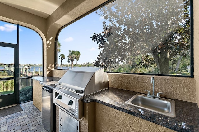 207 S Riverwalk Dr, Palm Coast, FL 32137 - view of patio with a sink and exterior kitchen