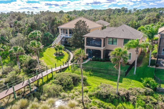 207 S Riverwalk Dr, Palm Coast, FL 32137 - aerial view of property and surrounding area with a heavily wooded area