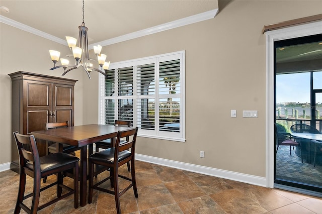 207 S Riverwalk Dr, Palm Coast, FL 32137 - dining room featuring ornamental molding and a chandelier