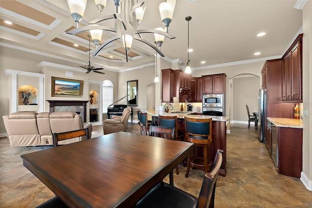 207 S Riverwalk Dr, Palm Coast, FL 32137 - dining room featuring arched walkways, ornamental molding, a ceiling fan, coffered ceiling, and recessed lighting