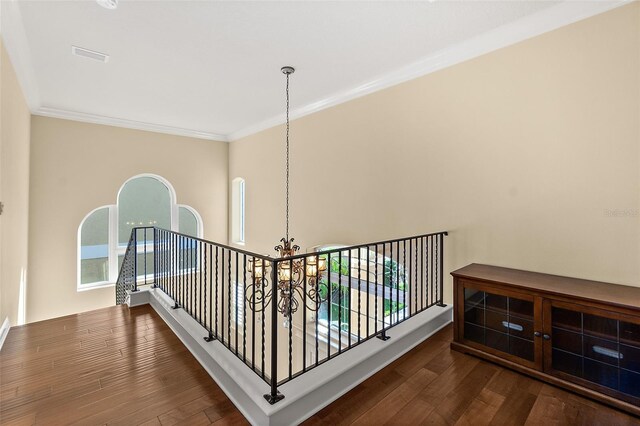 207 S Riverwalk Dr, Palm Coast, FL 32137 - stairs featuring a chandelier, ornamental molding, and wood finished floors