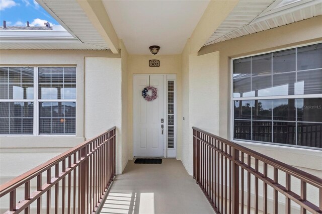 200 Riverfront Dr Unit D302, Palm Coast, FL 32137 - property entrance featuring stucco siding and a balcony