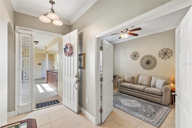 200 Riverfront Dr Unit D302, Palm Coast, FL 32137 - foyer with ornamental molding, ceiling fan, and light tile patterned floors