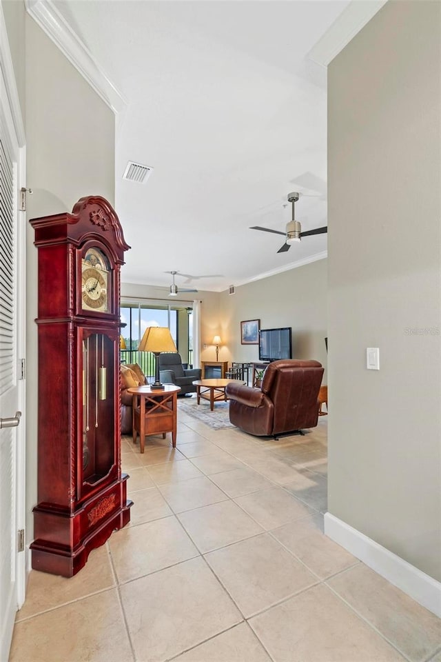 200 Riverfront Dr Unit D302, Palm Coast, FL 32137 - living area with ornamental molding, light tile patterned floors, and a ceiling fan