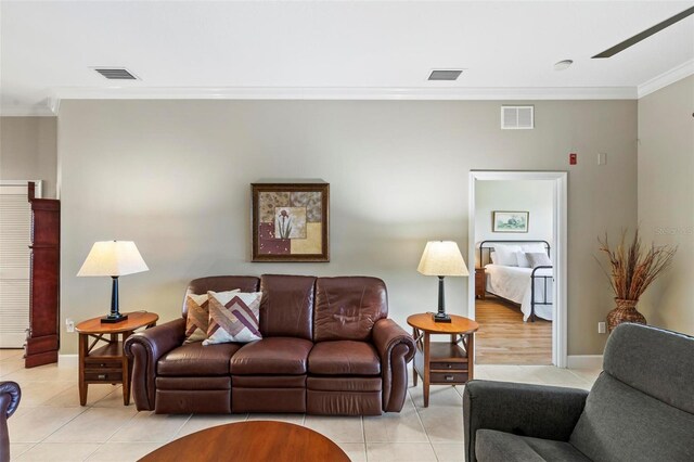 200 Riverfront Dr Unit D302, Palm Coast, FL 32137 - living room featuring light tile patterned floors and crown molding