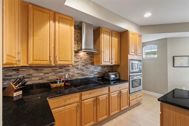 200 Riverfront Dr Unit D302, Palm Coast, FL 32137 - kitchen with stainless steel appliances, wall chimney range hood, backsplash, light tile patterned floors, and recessed lighting