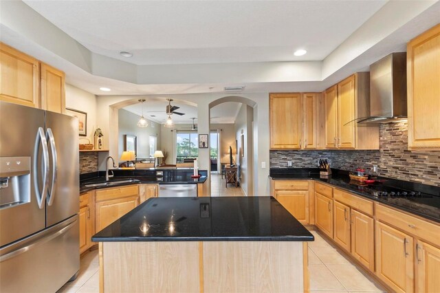 200 Riverfront Dr Unit D302, Palm Coast, FL 32137 - kitchen featuring stainless steel refrigerator with ice dispenser, wall chimney exhaust hood, light tile patterned floors, dishwashing machine, and arched walkways
