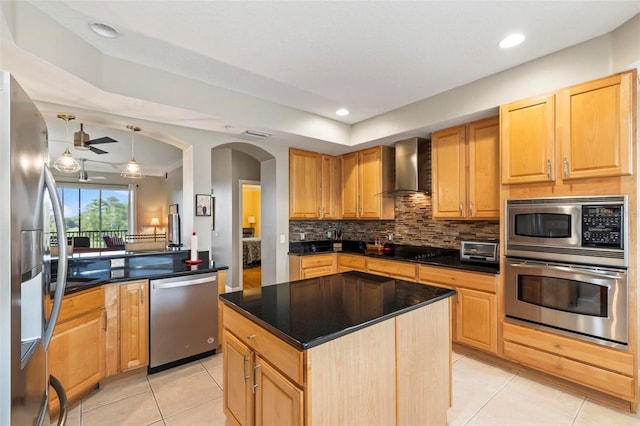 200 Riverfront Dr Unit D302, Palm Coast, FL 32137 - kitchen with appliances with stainless steel finishes, wall chimney exhaust hood, light tile patterned flooring, tasteful backsplash, and dark countertops