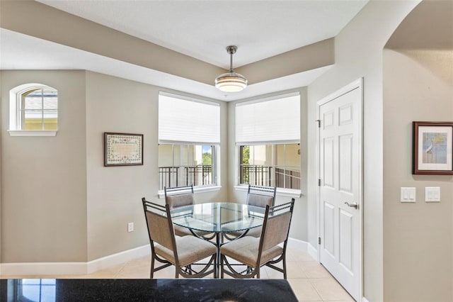 200 Riverfront Dr Unit D302, Palm Coast, FL 32137 - dining room with light tile patterned flooring and arched walkways