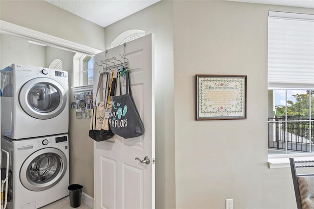 200 Riverfront Dr Unit D302, Palm Coast, FL 32137 - laundry room featuring estacked washer and dryer