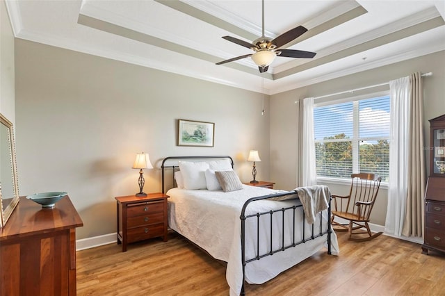 200 Riverfront Dr Unit D302, Palm Coast, FL 32137 - bedroom featuring a raised ceiling, ornamental molding, and light wood-type flooring