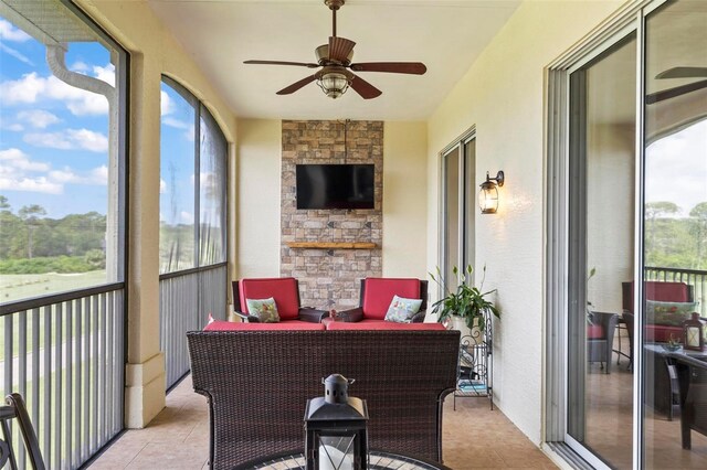 200 Riverfront Dr Unit D302, Palm Coast, FL 32137 - sunroom with ceiling fan, healthy amount of natural light, and tile patterned floors