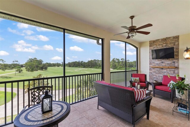 200 Riverfront Dr Unit D302, Palm Coast, FL 32137 - sunroom / solarium with ceiling fan, an outdoor hangout area, and view of scattered trees