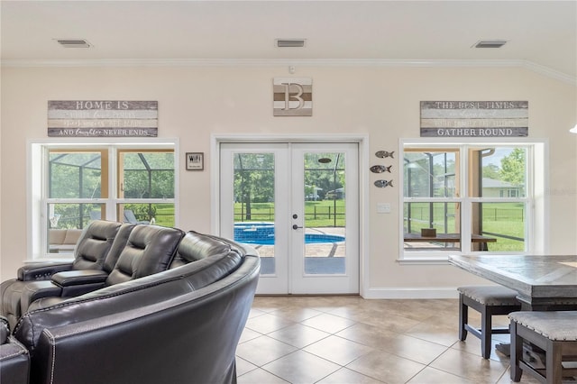 265 Pinehurst Pointe Dr, Saint Augustine, FL 32092 - living area with french doors, light tile patterned floors, and crown molding