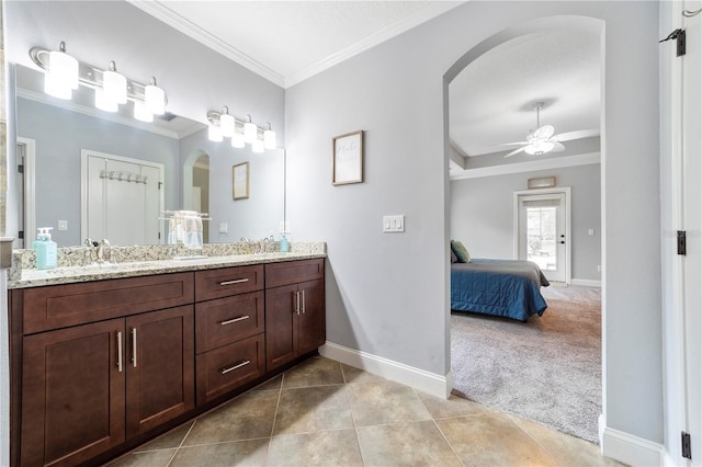 265 Pinehurst Pointe Dr, Saint Augustine, FL 32092 - ensuite bathroom featuring crown molding, double vanity, a ceiling fan, and tile patterned floors
