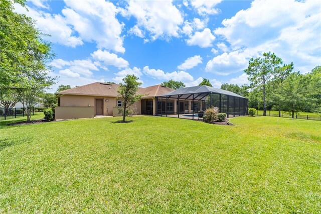 265 Pinehurst Pointe Dr, Saint Augustine, FL 32092 - rear view of house with a lanai, stucco siding, and a swimming pool