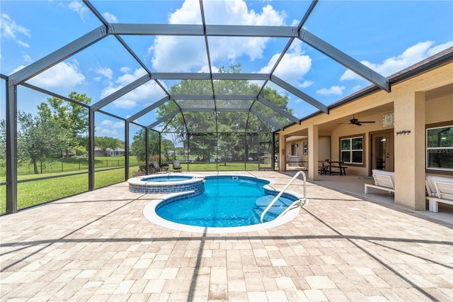 265 Pinehurst Pointe Dr, Saint Augustine, FL 32092 - view of swimming pool with a patio area, ceiling fan, a pool with connected hot tub, a lawn, and glass enclosure