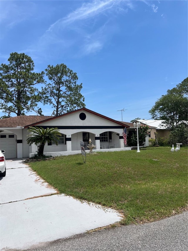 250 Beechwood Ln, Palm Coast, FL 32137 - view of front facade featuring stucco siding, a front yard, driveway, and an attached garage