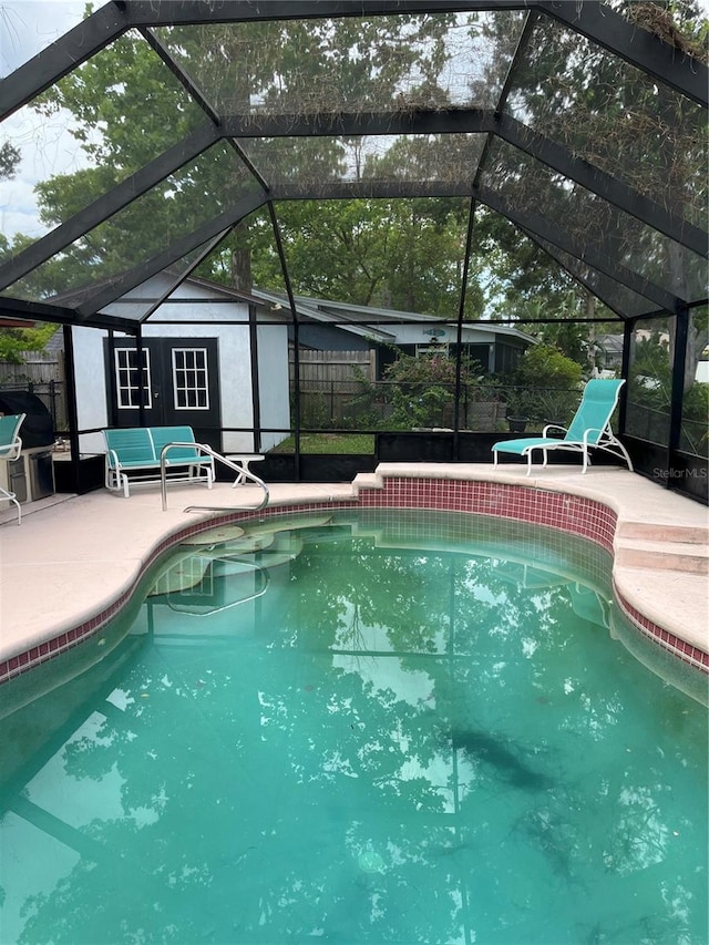 250 Beechwood Ln, Palm Coast, FL 32137 - swimming pool with an outbuilding, a patio, a lanai, and a grill