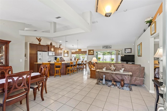 118 Pine Grove Dr, Palm Coast, FL 32164 - living area with light tile patterned floors and lofted ceiling