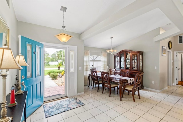 118 Pine Grove Dr, Palm Coast, FL 32164 - entrance foyer featuring a chandelier, light tile patterned floors, baseboards, and lofted ceiling