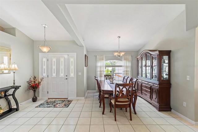 118 Pine Grove Dr, Palm Coast, FL 32164 - entrance foyer featuring vaulted ceiling, baseboards, a chandelier, and light tile patterned floors