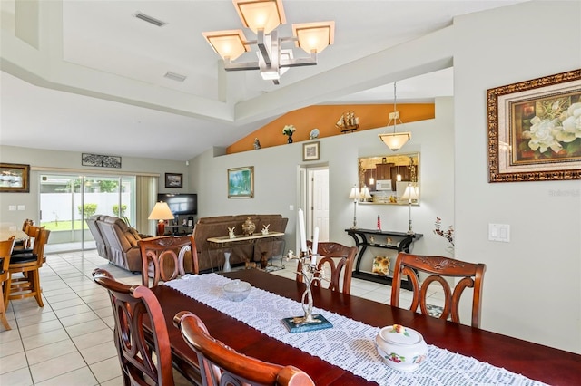 118 Pine Grove Dr, Palm Coast, FL 32164 - dining area featuring light tile patterned floors, lofted ceiling, and a chandelier