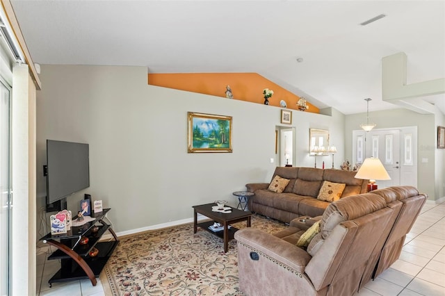 118 Pine Grove Dr, Palm Coast, FL 32164 - living area featuring light tile patterned floors, vaulted ceiling, and baseboards