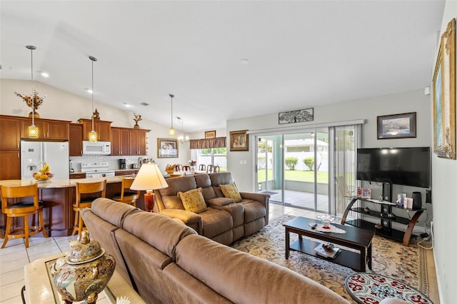 118 Pine Grove Dr, Palm Coast, FL 32164 - living room with lofted ceiling, light tile patterned flooring, and plenty of natural light
