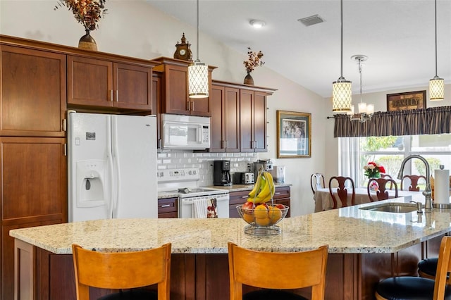 118 Pine Grove Dr, Palm Coast, FL 32164 - kitchen with white appliances, a sink, lofted ceiling, a kitchen breakfast bar, and backsplash