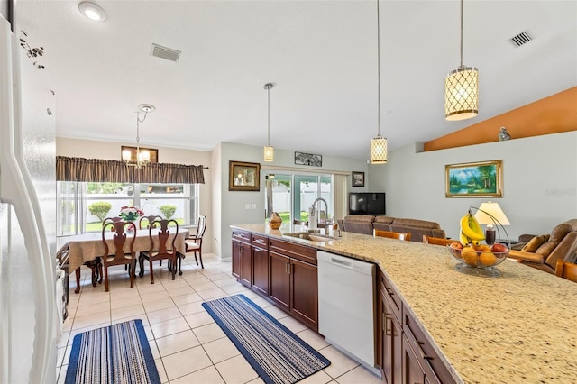118 Pine Grove Dr, Palm Coast, FL 32164 - kitchen featuring white appliances, a sink, open floor plan, a chandelier, and healthy amount of natural light