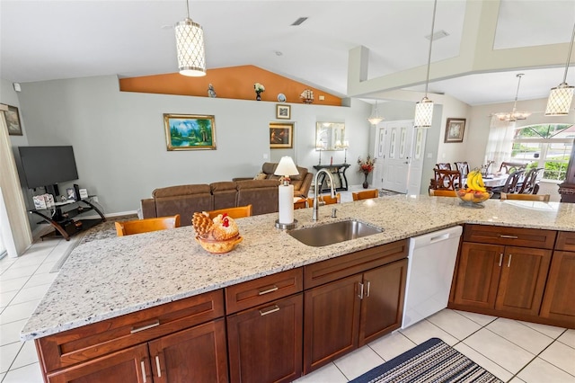 118 Pine Grove Dr, Palm Coast, FL 32164 - kitchen featuring white dishwasher, a sink, open floor plan, lofted ceiling, and light tile patterned flooring