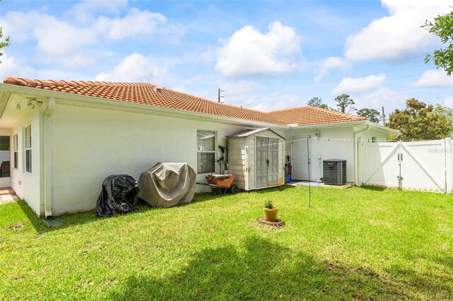118 Pine Grove Dr, Palm Coast, FL 32164 - back of house featuring a gate, a tile roof, cooling unit, and stucco siding