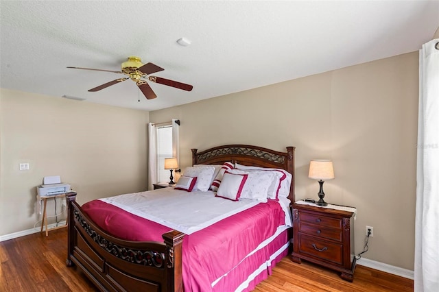 118 Pine Grove Dr, Palm Coast, FL 32164 - bedroom with wood finished floors, baseboards, and a ceiling fan