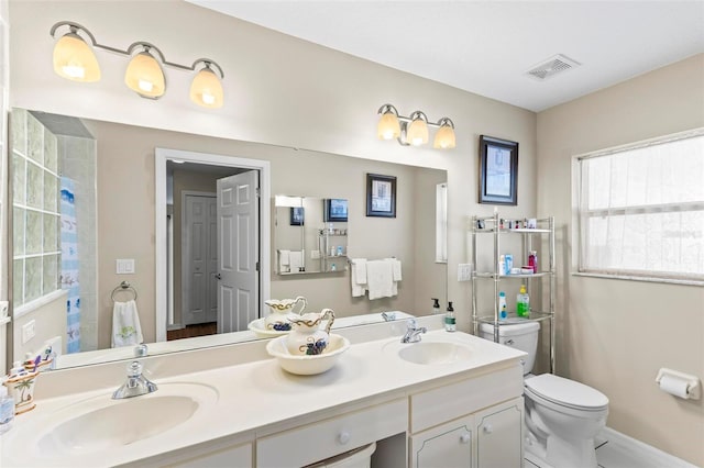 118 Pine Grove Dr, Palm Coast, FL 32164 - full bathroom with double vanity and toilet