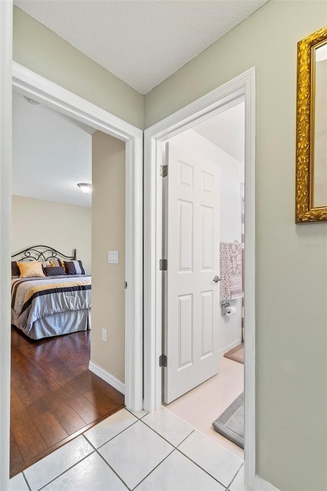 118 Pine Grove Dr, Palm Coast, FL 32164 - hallway featuring tile patterned flooring and baseboards