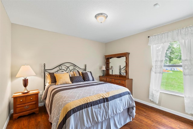 118 Pine Grove Dr, Palm Coast, FL 32164 - bedroom featuring dark wood-type flooring and baseboards