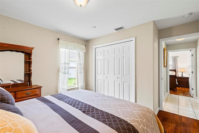 118 Pine Grove Dr, Palm Coast, FL 32164 - bedroom with wood finished floors, a closet, and baseboards