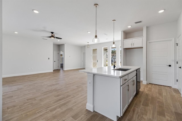 2 Seamanship Trl, Palm Coast, FL 32164 - kitchen featuring a sink, ceiling fan, light countertops, light wood-style floors, and recessed lighting
