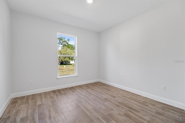 2 Seamanship Trl, Palm Coast, FL 32164 - unfurnished room with wood finished floors and baseboards