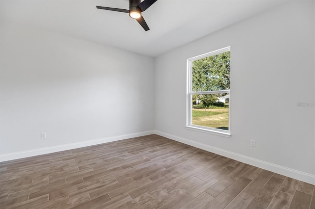2 Seamanship Trl, Palm Coast, FL 32164 - unfurnished room with wood finished floors, a ceiling fan, and baseboards