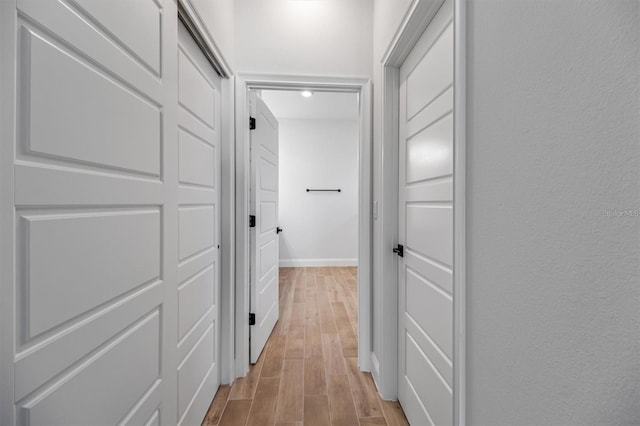 2 Seamanship Trl, Palm Coast, FL 32164 - hallway with light wood-style floors and baseboards