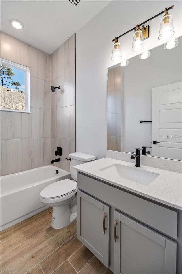 2 Seamanship Trl, Palm Coast, FL 32164 - full bath featuring vanity, toilet, wood finished floors, tub / shower combination, and recessed lighting
