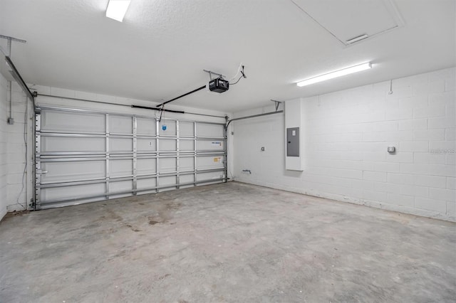 2 Seamanship Trl, Palm Coast, FL 32164 - garage with a garage door opener, electric panel, and concrete block wall