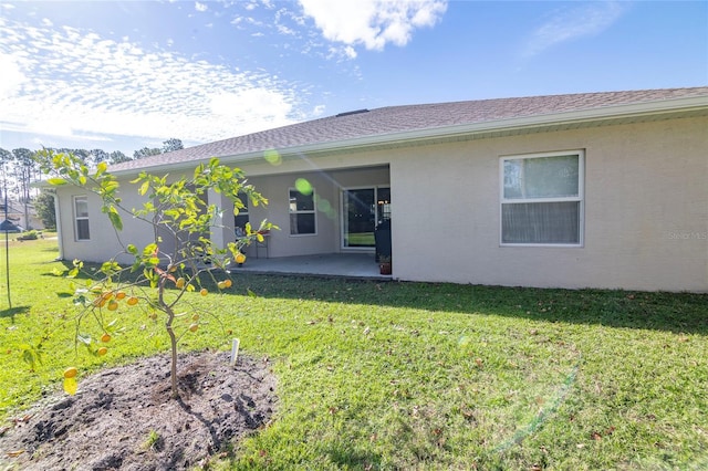 15 Raleigh Dr, Palm Coast, FL 32164 - rear view of property featuring a patio and a yard